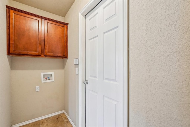 laundry room with cabinets and washer hookup