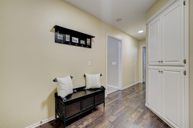 hall with dark hardwood / wood-style flooring