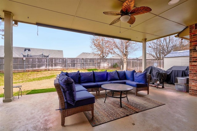 view of patio with ceiling fan, grilling area, and outdoor lounge area