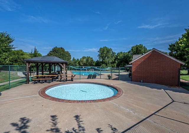 view of pool featuring a gazebo and a patio area