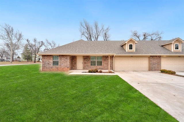 view of front of house with a garage and a front yard