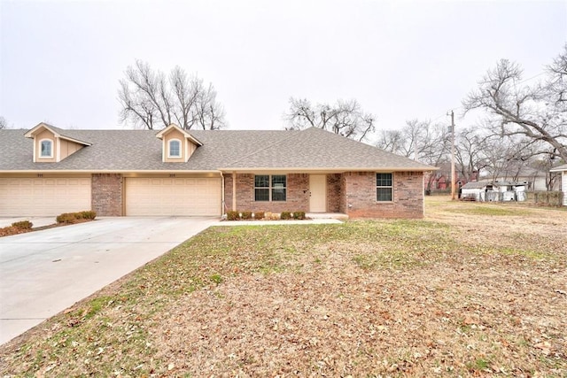 ranch-style home featuring a garage and a front lawn