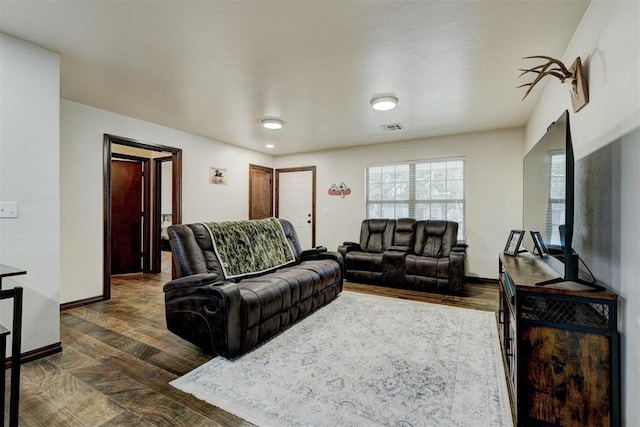 living room featuring dark hardwood / wood-style floors