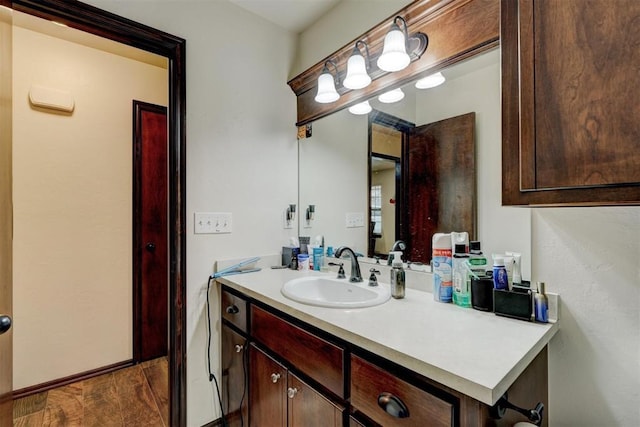 bathroom featuring vanity and hardwood / wood-style floors