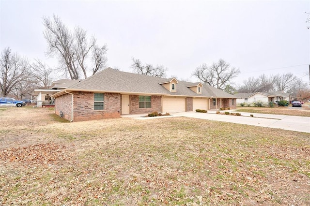 ranch-style home featuring a garage and a front lawn