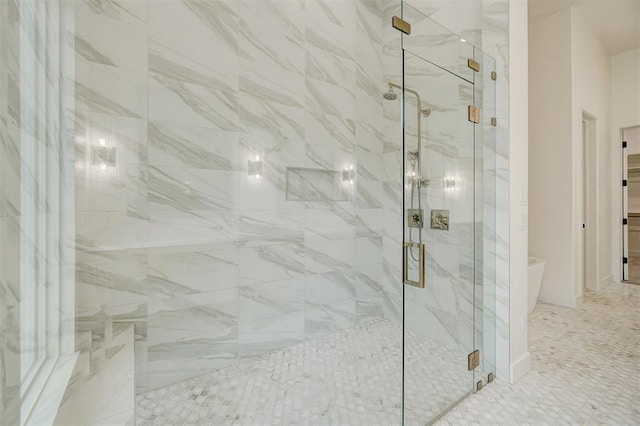 bathroom featuring an enclosed shower