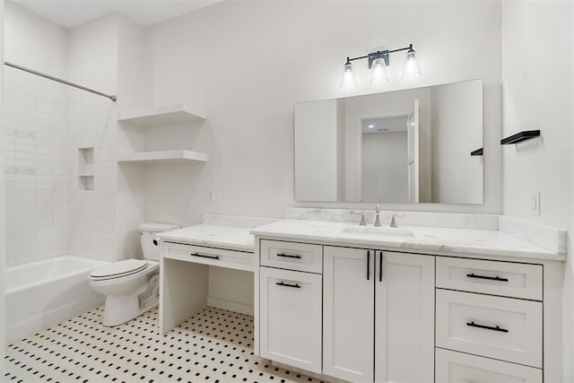 full bathroom with tiled shower / bath, vanity, and toilet