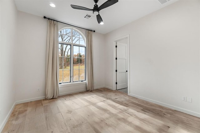 unfurnished room featuring ceiling fan and light hardwood / wood-style floors