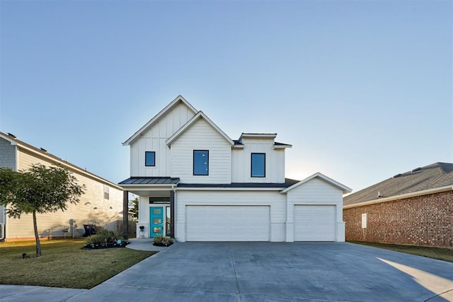 view of front facade featuring a garage and a front lawn