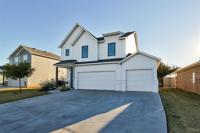 view of front of home featuring a garage and a front yard