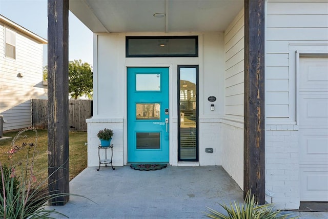 property entrance featuring a patio