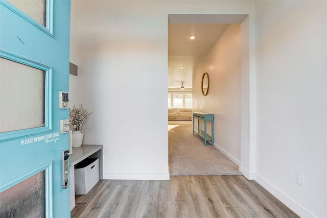 corridor featuring light hardwood / wood-style floors