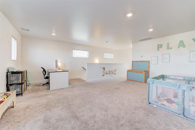 carpeted living room with plenty of natural light