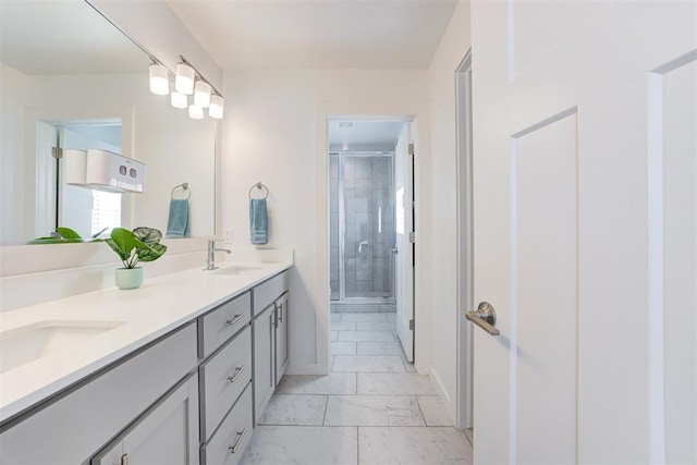 bathroom featuring vanity and an enclosed shower