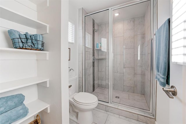 bathroom with walk in shower and toilet