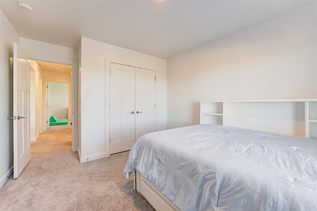 carpeted bedroom with a closet