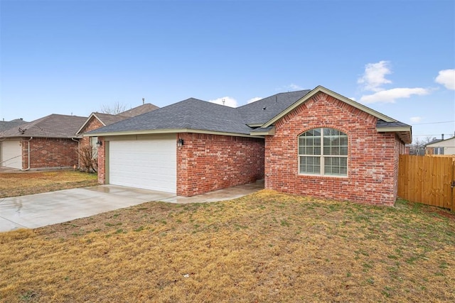 ranch-style house with a garage and a front lawn