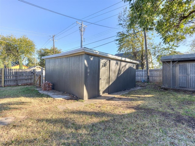 view of shed with a fenced backyard