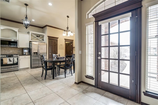 interior space with an inviting chandelier and crown molding