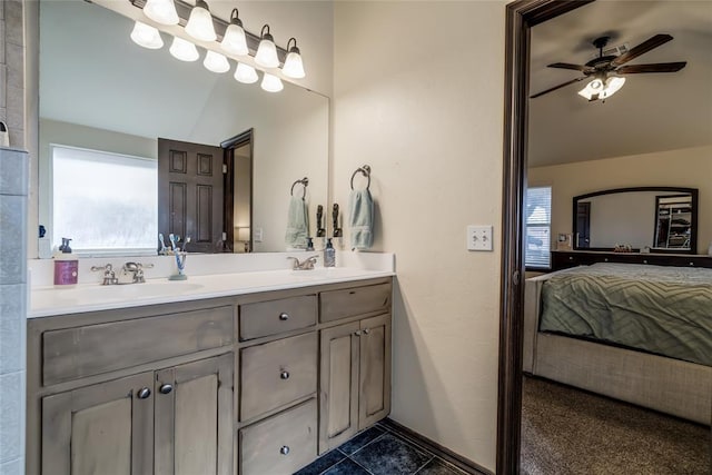 bathroom with vanity, lofted ceiling, tile patterned floors, and ceiling fan