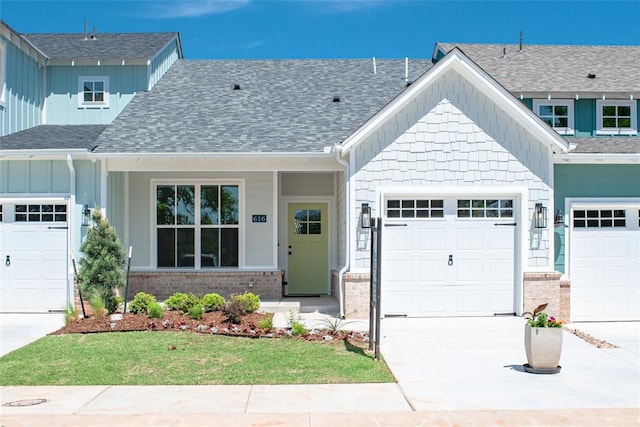 616 Montauk Way, Edmond, OK 73034 - craftsman inspired home with driveway, roof with shingles, board and batten siding, and a garage