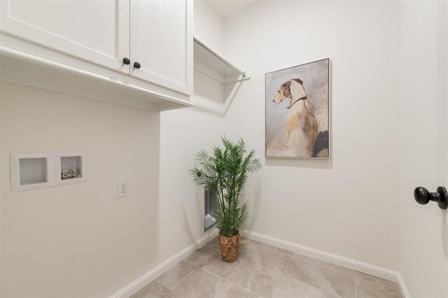 616 Montauk Way, Edmond, OK 73034 - laundry room featuring baseboards, hookup for a washing machine, light tile patterned floors, and cabinet space