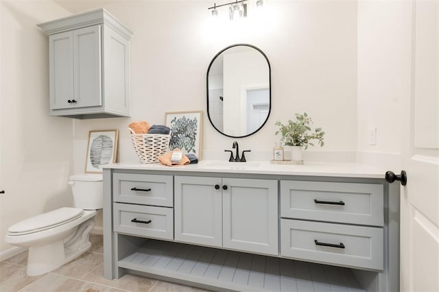 616 Montauk Way, Edmond, OK 73034 - bathroom with vanity, toilet, tile patterned flooring, and baseboards