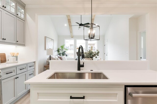 616 Montauk Way, Edmond, OK 73034 - kitchen with a sink, light countertops, open floor plan, dishwasher, and vaulted ceiling with beams