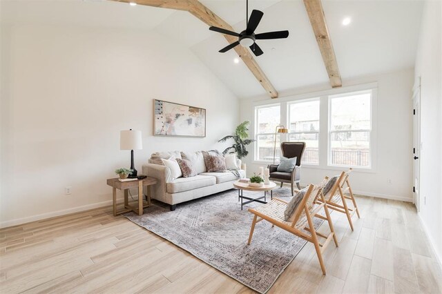 616 Montauk Way, Edmond, OK 73034 - living room featuring baseboards, vaulted ceiling with beams, a ceiling fan, and light wood-style floors