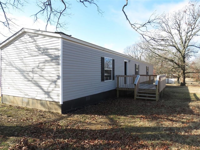 view of home's exterior featuring a deck