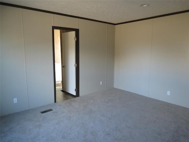 spare room with dark carpet