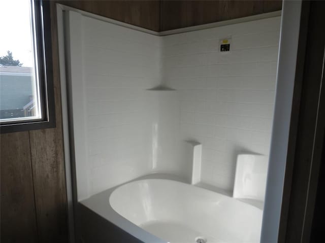 bathroom with a tub