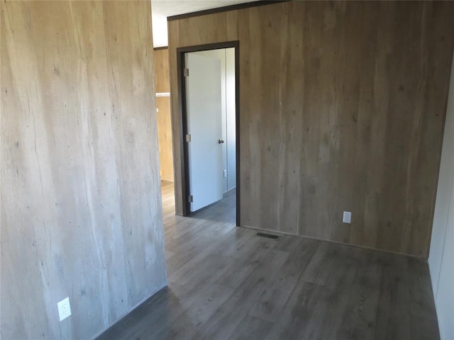 empty room featuring dark hardwood / wood-style floors