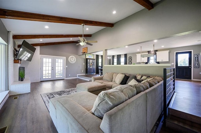 living room featuring dark hardwood / wood-style floors, high vaulted ceiling, ceiling fan, beam ceiling, and french doors