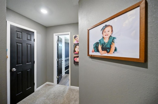 foyer entrance featuring light colored carpet