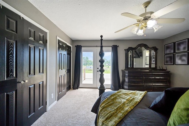 bedroom featuring ceiling fan, carpet floors, access to outside, and a textured ceiling