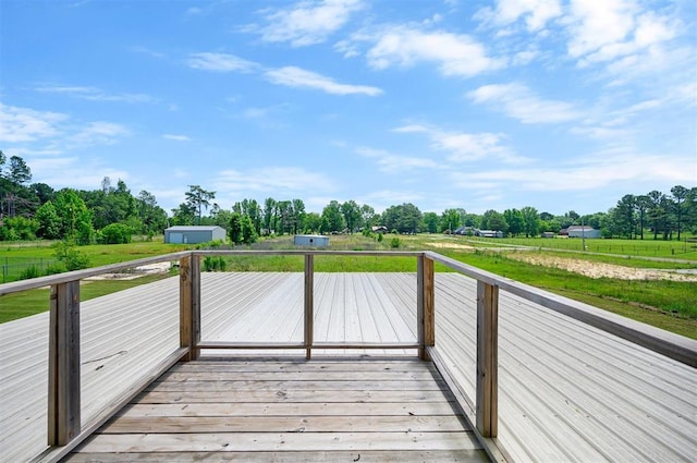 wooden deck featuring a rural view