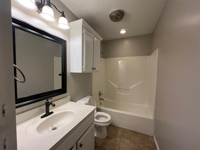 full bathroom with shower / washtub combination, vanity, tile patterned floors, and toilet