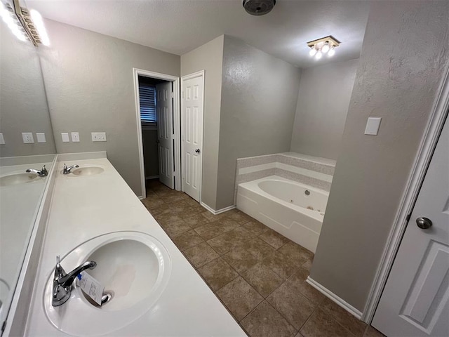 bathroom featuring vanity and a bathing tub