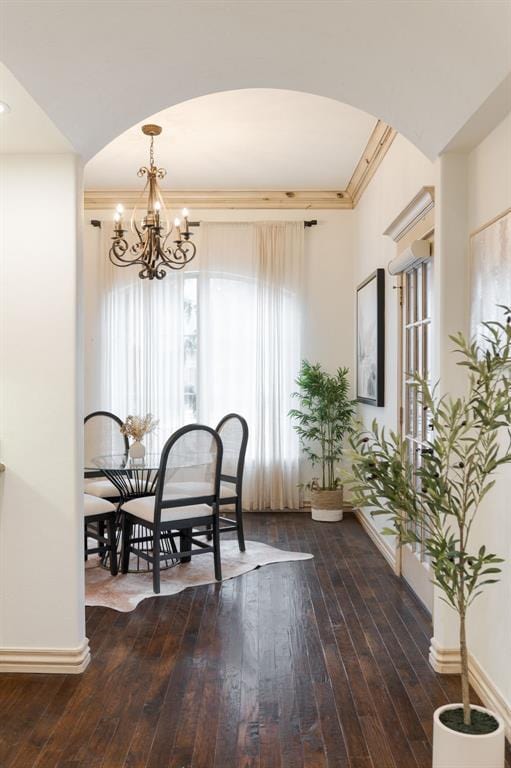 dining room featuring an inviting chandelier and dark hardwood / wood-style flooring