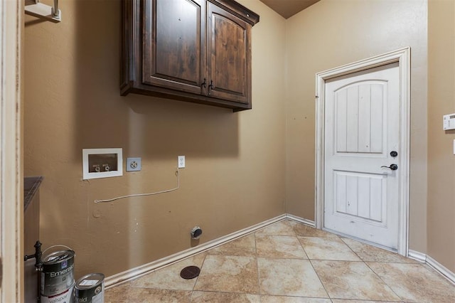 laundry area with cabinets, hookup for a washing machine, hookup for an electric dryer, and light tile patterned floors