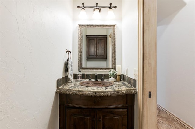 bathroom with vanity and tile patterned flooring