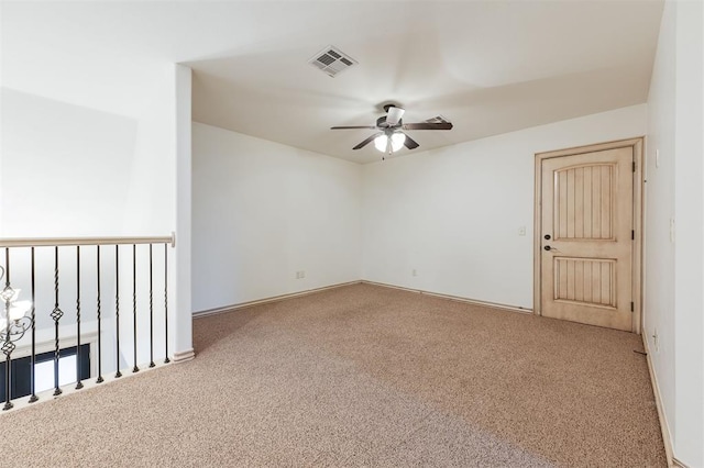 carpeted empty room with ceiling fan