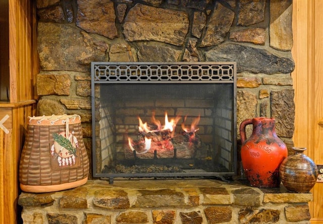 interior details with a warm lit fireplace