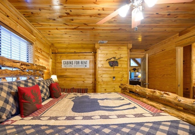 unfurnished bedroom with wood walls and wood ceiling