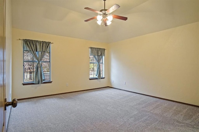 carpeted empty room with ceiling fan