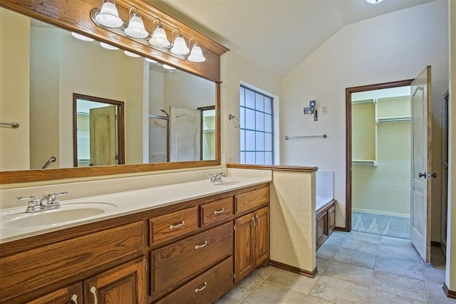 bathroom with lofted ceiling, vanity, and plus walk in shower