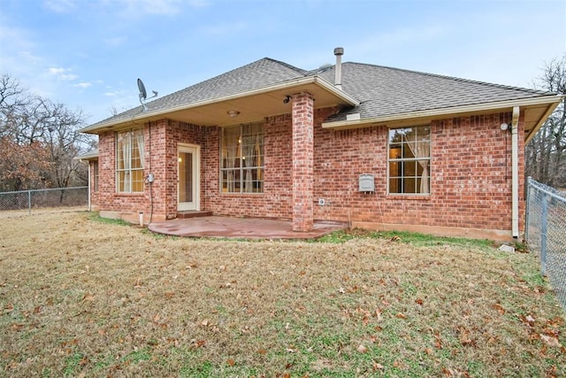 back of property featuring a yard and a patio area