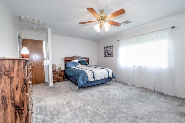 bedroom featuring light carpet and ceiling fan