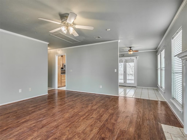 spare room with ceiling fan, ornamental molding, visible vents, and light wood-style floors